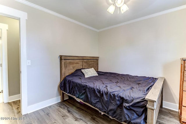 4838 Stillwell Rd, Wilmington, NC 28412 - bedroom featuring ornamental molding, wood finished floors, baseboards, and a ceiling fan