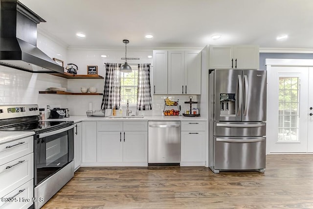 4838 Stillwell Rd, Wilmington, NC 28412 - kitchen with stainless steel appliances, wall chimney range hood, a sink, crown molding, and light countertops