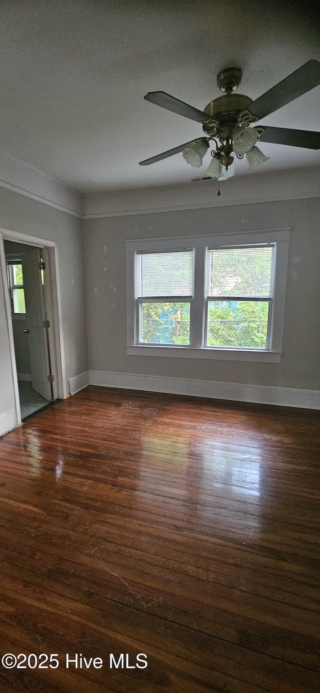 1205 S 7th St, Wilmington, NC 28401 - empty room featuring wood finished floors, plenty of natural light, and baseboards