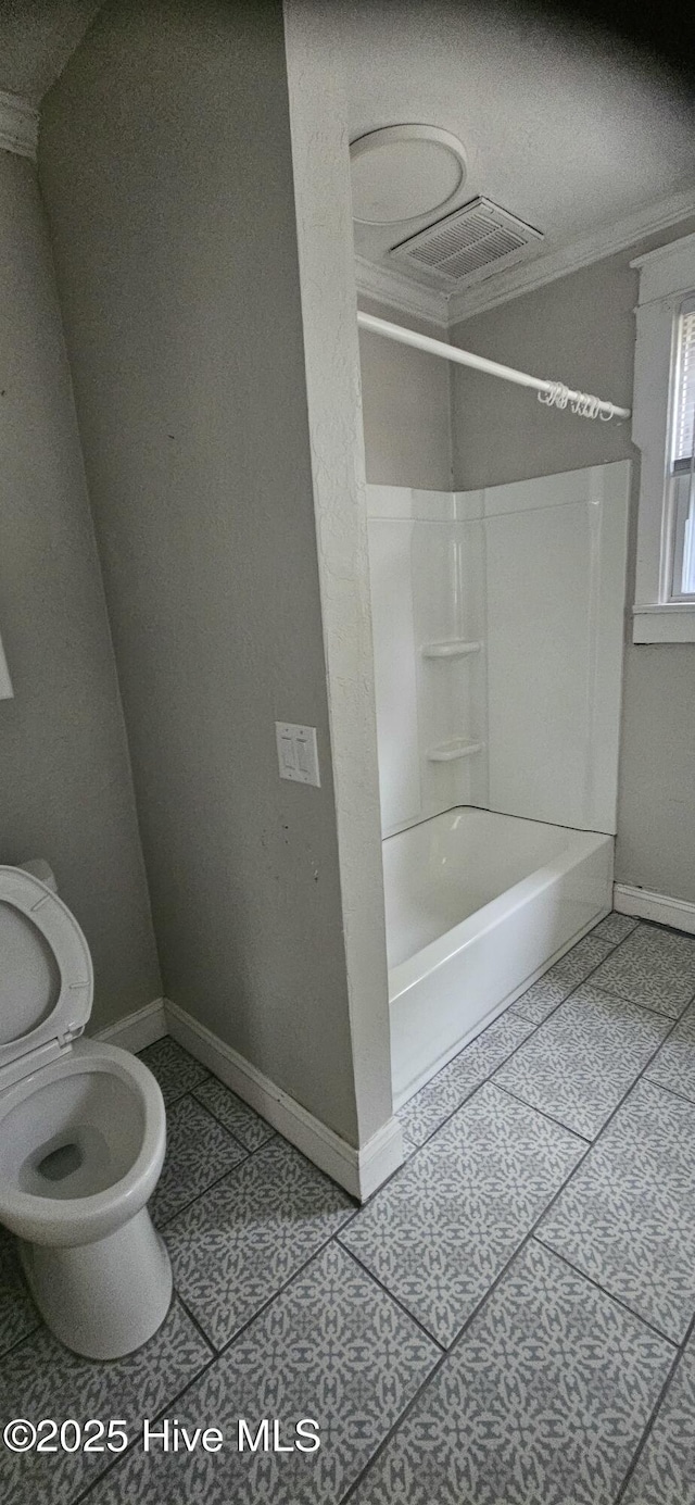1205 S 7th St, Wilmington, NC 28401 - bathroom featuring toilet, ornamental molding, shower / tub combination, baseboards, and tile patterned flooring