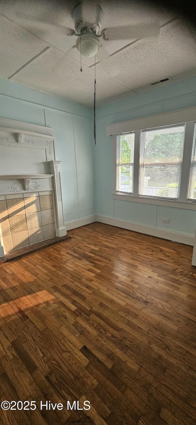 1205 S 7th St, Wilmington, NC 28401 - unfurnished living room with a ceiling fan, dark wood-style floors, and a textured ceiling