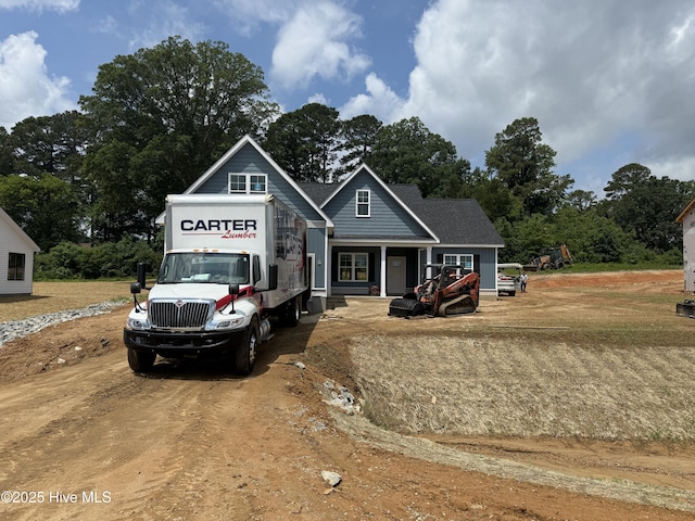 183 Tee Dr, Selma, NC 27576 - view of front of house with driveway and view of scattered trees