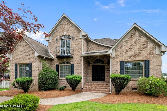 151 Pungo View Rd, Belhaven, NC 27810 - view of front facade with a balcony, brick siding, roof with shingles, and crawl space