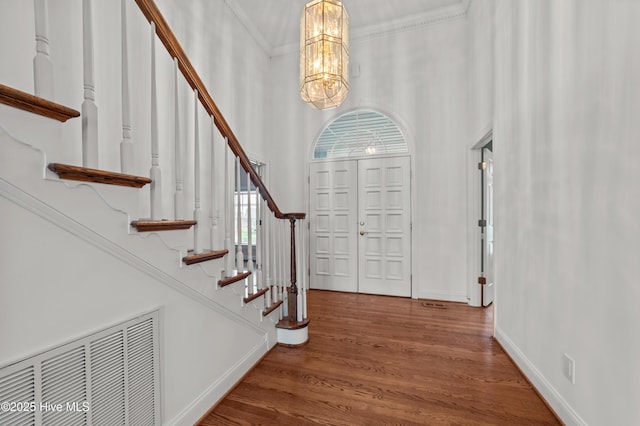 151 Pungo View Rd, Belhaven, NC 27810 - foyer with stairway, a chandelier, wood finished floors, baseboards, and ornamental molding