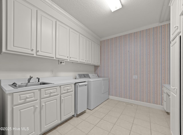 151 Pungo View Rd, Belhaven, NC 27810 - laundry room featuring washing machine and clothes dryer, baseboards, cabinet space, a textured ceiling, and crown molding