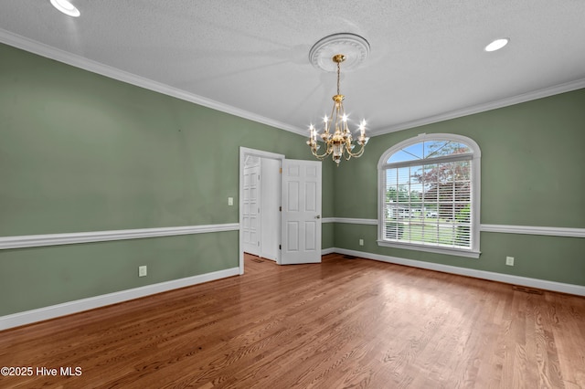 151 Pungo View Rd, Belhaven, NC 27810 - unfurnished room with a chandelier, wood finished floors, ornamental molding, a textured ceiling, and baseboards