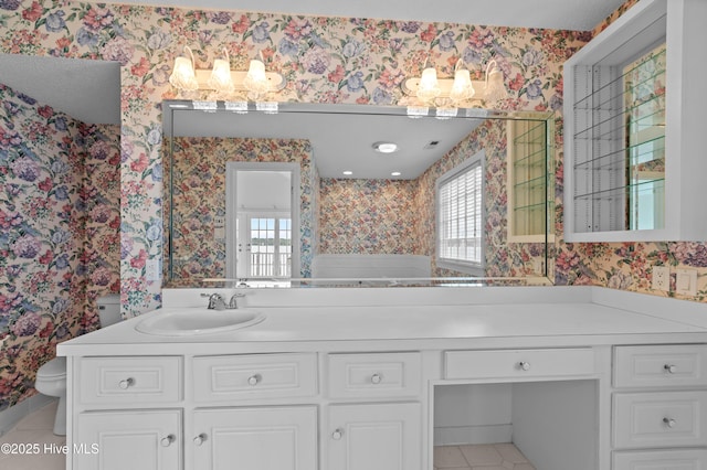 151 Pungo View Rd, Belhaven, NC 27810 - full bath with wallpapered walls, toilet, plenty of natural light, double vanity, and tile patterned flooring