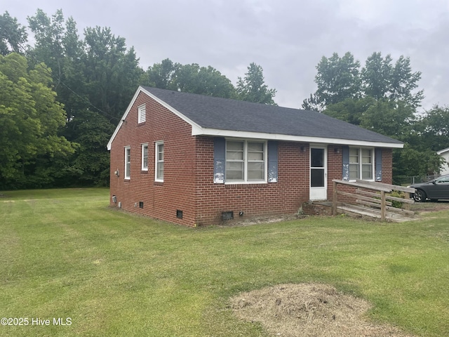 5011 Community Grocery Rd, Wilson, NC 27893 - view of front of house with a front yard, brick siding, and crawl space