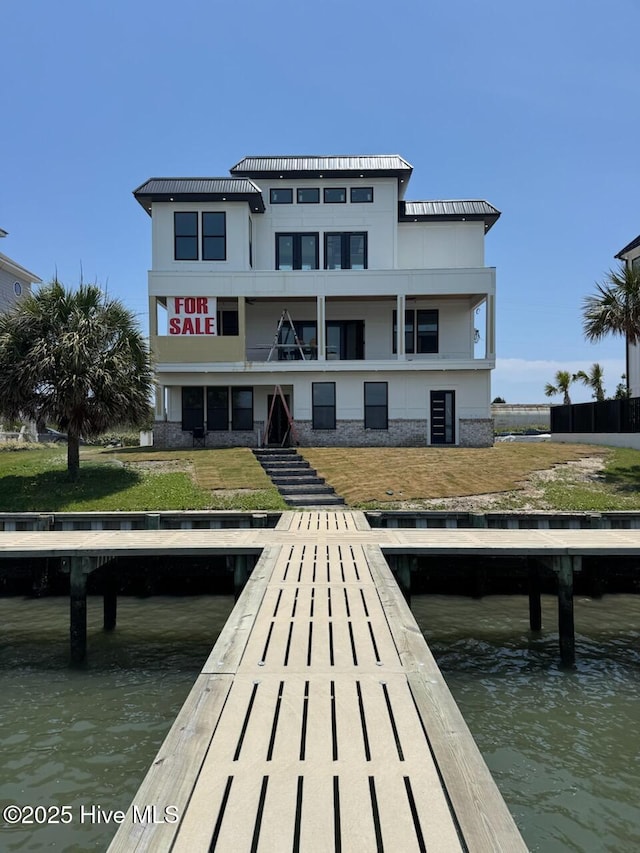 208 Radio Island Rd, Morehead City, NC 28557 - dock area with a water view, a balcony, stairs, and a yard