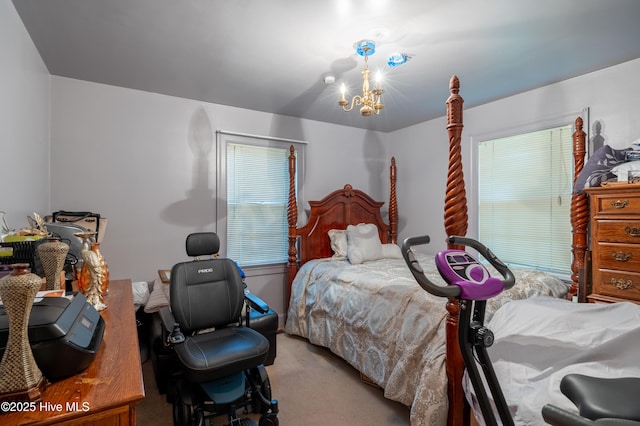108 Stadium St SW, Wilson, NC 27893 - bedroom with light carpet and a chandelier