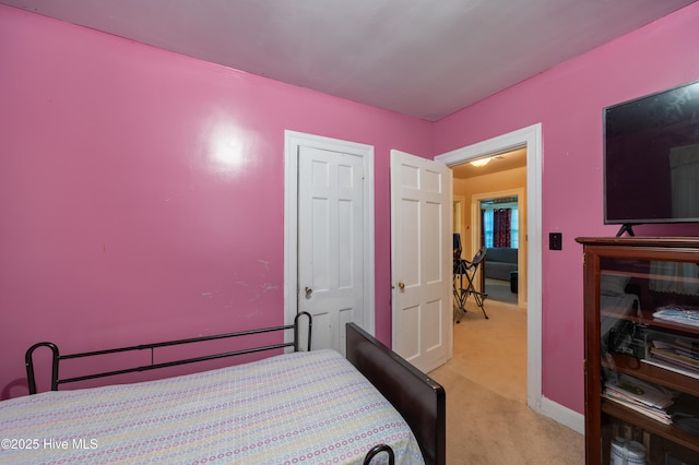 108 Stadium St SW, Wilson, NC 27893 - bedroom with light colored carpet and baseboards