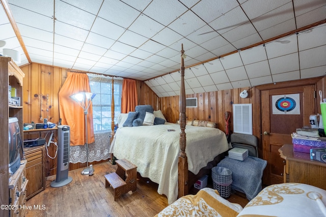 108 Stadium St SW, Wilson, NC 27893 - bedroom with wood finished floors, wooden walls, and vaulted ceiling