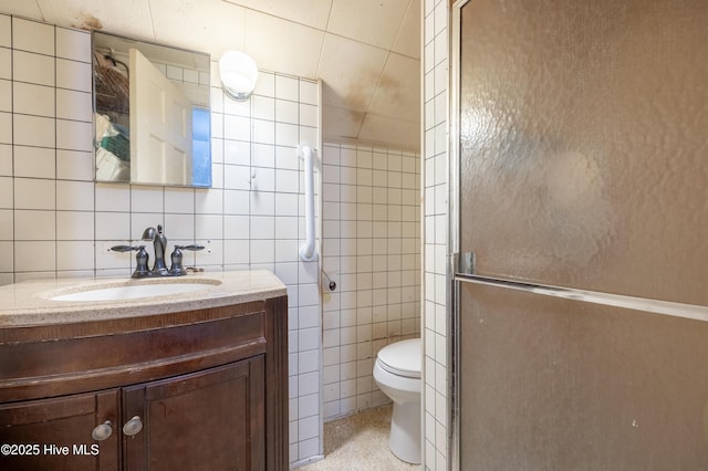 108 Stadium St SW, Wilson, NC 27893 - bathroom with tile walls, vanity, and a shower with door