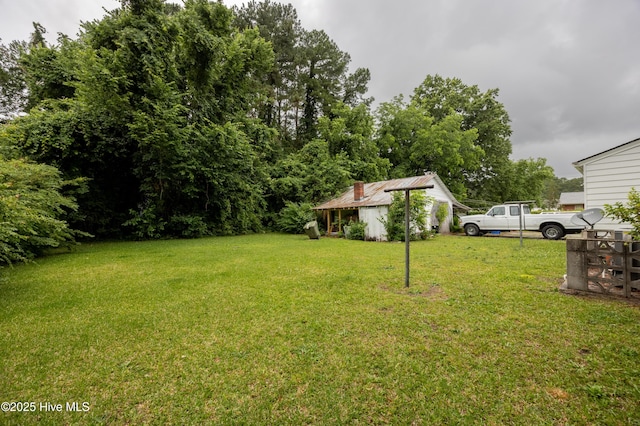 108 Stadium St SW, Wilson, NC 27893 - view of grassy yard with an outbuilding