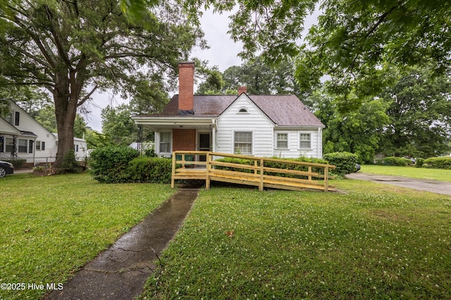 108 Stadium St SW, Wilson, NC 27893 - bungalow-style home with a chimney, a wooden deck, and a shingled roof