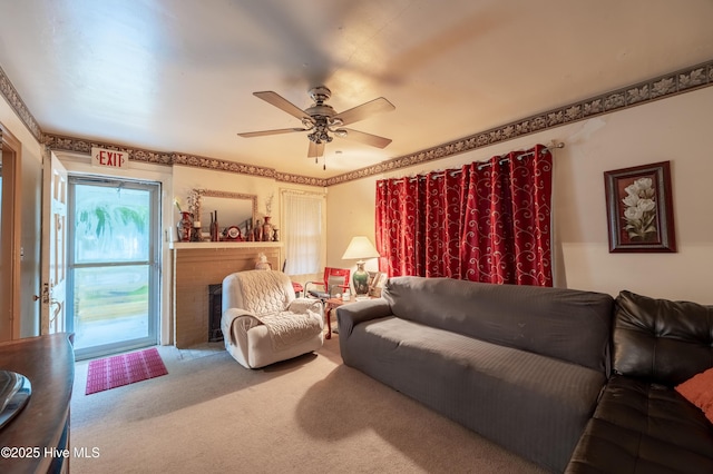108 Stadium St SW, Wilson, NC 27893 - living area with carpet flooring, a fireplace, and ceiling fan