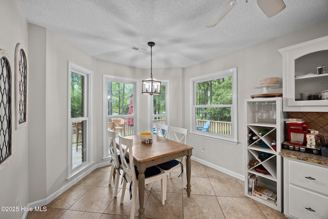 112 Lakeview Ln, Washington, NC 27889 - dining room with light tile patterned floors, a ceiling fan, and a textured ceiling