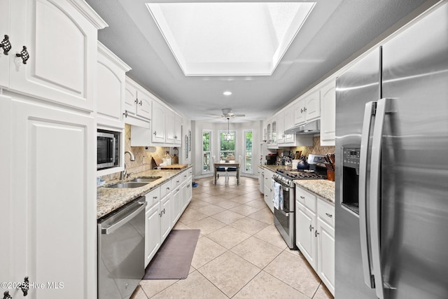 112 Lakeview Ln, Washington, NC 27889 - kitchen featuring stainless steel appliances, under cabinet range hood, tasteful backsplash, recessed lighting, and white cabinets