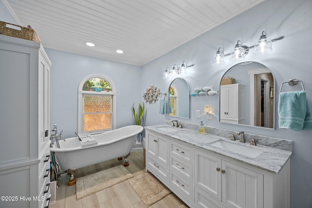 112 Lakeview Ln, Washington, NC 27889 - bathroom with double vanity, a freestanding bath, wood finished floors, and recessed lighting