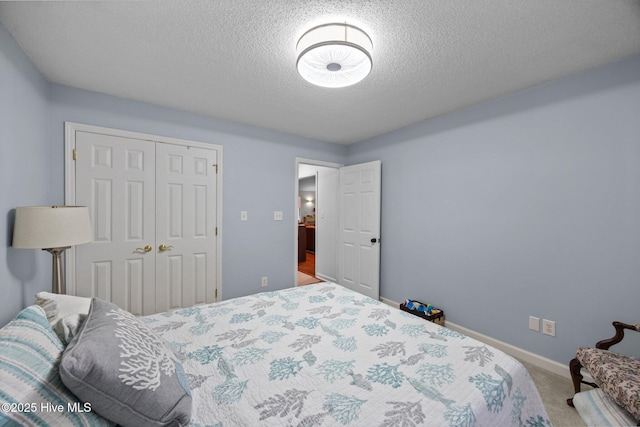 112 Lakeview Ln, Washington, NC 27889 - carpeted bedroom featuring a textured ceiling and a closet