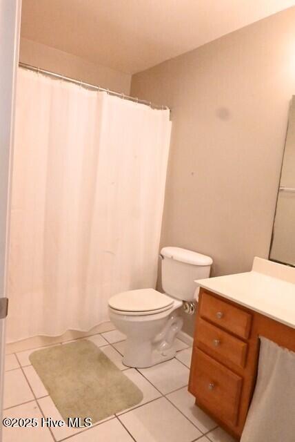 5610 Carolina Beach Rd Unit 6, Wilmington, NC 28412 - full bathroom with tile patterned flooring, vanity, toilet, and a shower with curtain