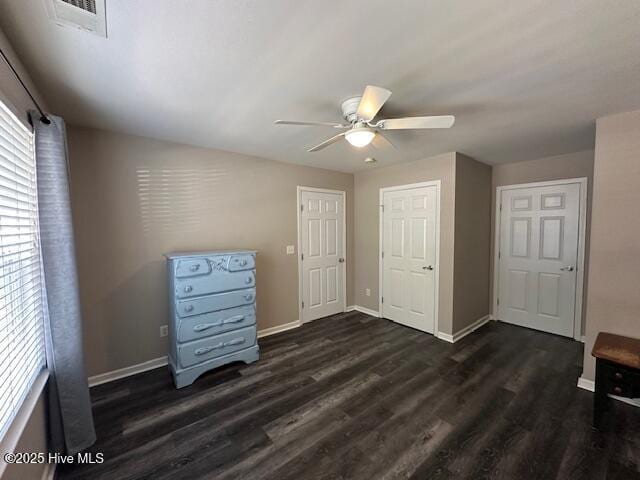 5610 Carolina Beach Rd Unit 6, Wilmington, NC 28412 - unfurnished bedroom featuring dark wood-style floors, baseboards, and ceiling fan