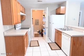 5610 Carolina Beach Rd Unit 6, Wilmington, NC 28412 - kitchen with white appliances, light tile patterned flooring, light countertops, and a sink