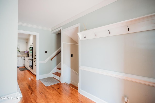 1103 Greenbriar Rd NW, Wilson, NC 27896 - mudroom featuring light wood-type flooring and ornamental molding
