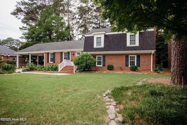 1103 Greenbriar Rd NW, Wilson, NC 27896 - view of front of home featuring brick siding, a front yard, and a shingled roof