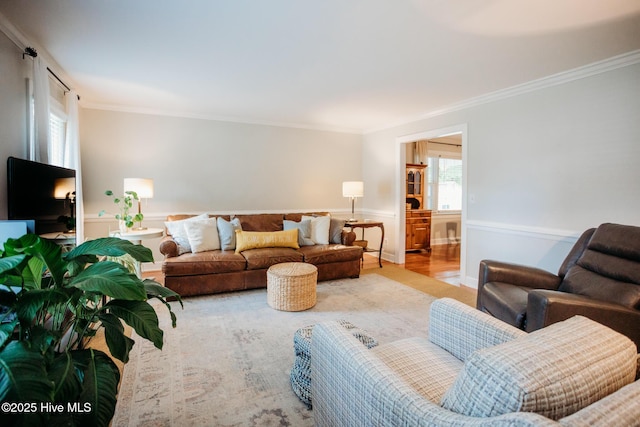 1103 Greenbriar Rd NW, Wilson, NC 27896 - living area with crown molding, wood finished floors, and wainscoting