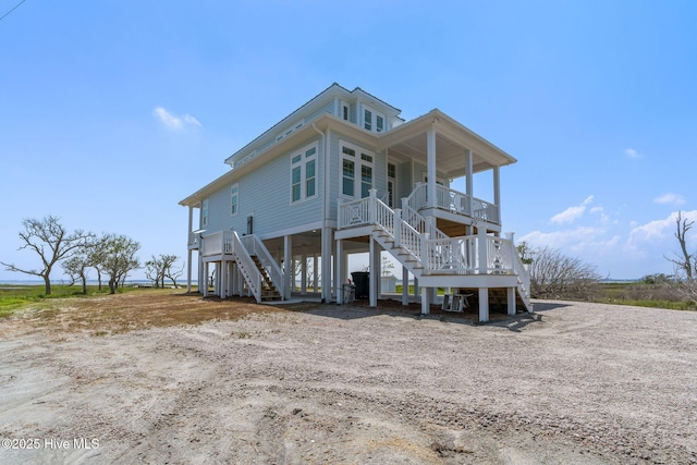 316 Bettie Path Rd, Beaufort, NC 28516 - back of property with stairway, a porch, and a carport