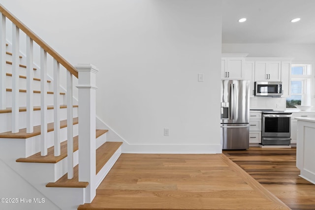 316 Bettie Path Rd, Beaufort, NC 28516 - kitchen featuring stainless steel appliances, light countertops, white cabinetry, recessed lighting, and baseboards