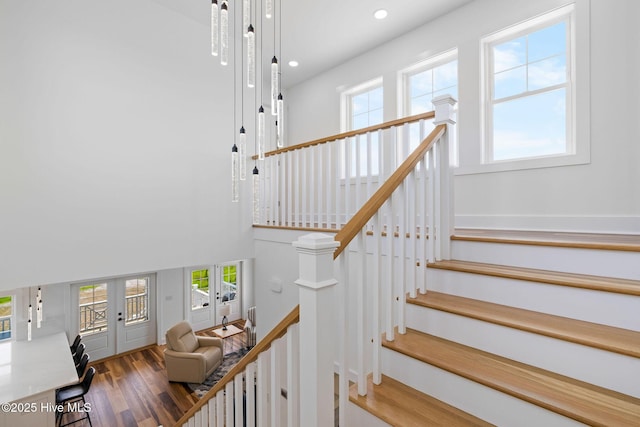316 Bettie Path Rd, Beaufort, NC 28516 - staircase with french doors, wood finished floors, recessed lighting, and a high ceiling