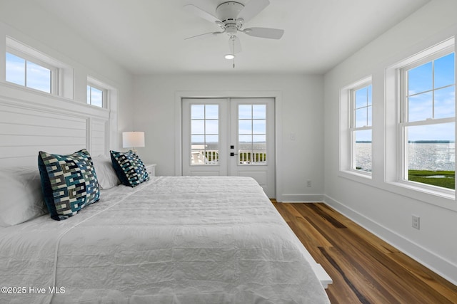 316 Bettie Path Rd, Beaufort, NC 28516 - bedroom with baseboards, wood finished floors, access to exterior, and a ceiling fan