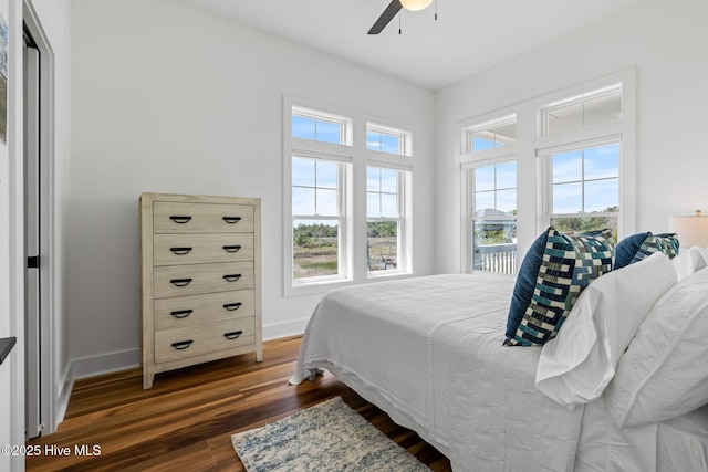 316 Bettie Path Rd, Beaufort, NC 28516 - bedroom featuring multiple windows, dark wood finished floors, baseboards, and ceiling fan