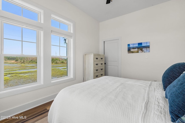 316 Bettie Path Rd, Beaufort, NC 28516 - bedroom featuring wood finished floors, baseboards, and a ceiling fan