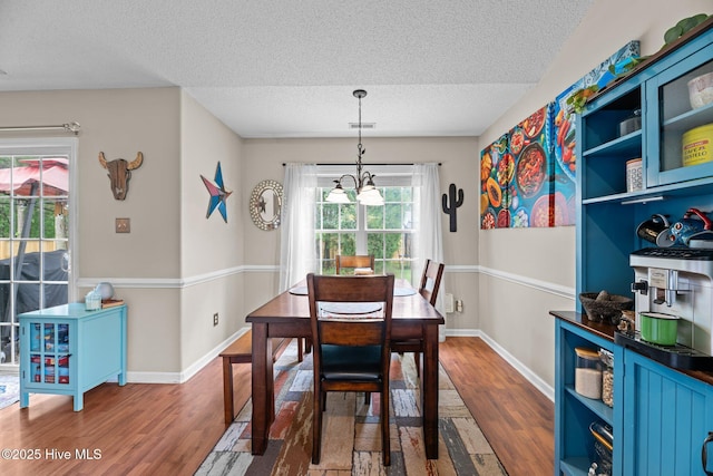 302 Fairmount Way, New Bern, NC 28562 - dining space with a textured ceiling, wood finished floors, and a chandelier