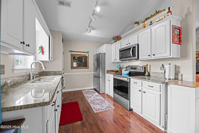 302 Fairmount Way, New Bern, NC 28562 - kitchen with appliances with stainless steel finishes, white cabinets, wood finished floors, light stone countertops, and a textured ceiling