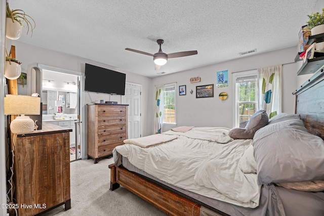 302 Fairmount Way, New Bern, NC 28562 - bedroom featuring light colored carpet, multiple windows, a textured ceiling, ensuite bathroom, and a closet