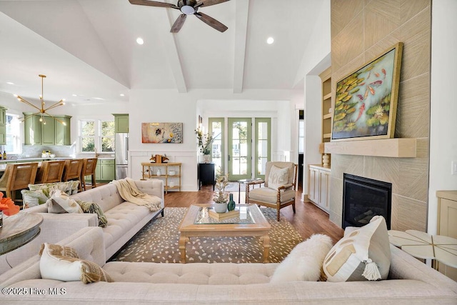 3810 River Park Way NE, Leland, NC 28451 - living area featuring light wood-type flooring, recessed lighting, a large fireplace, a ceiling fan, and a chandelier