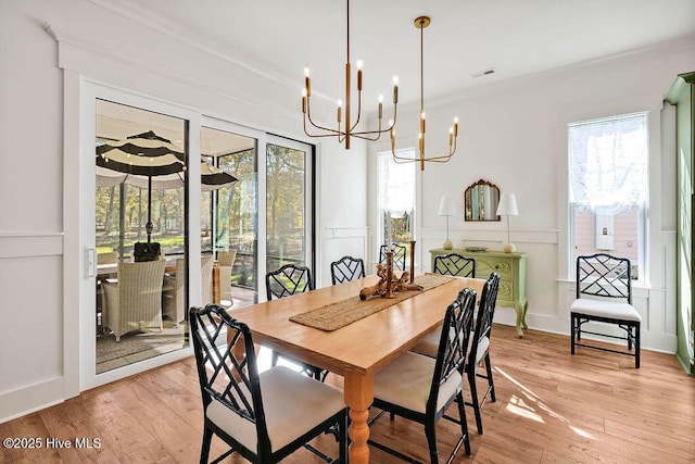 3810 River Park Way NE, Leland, NC 28451 - dining space featuring a chandelier, light wood-style floors, and crown molding