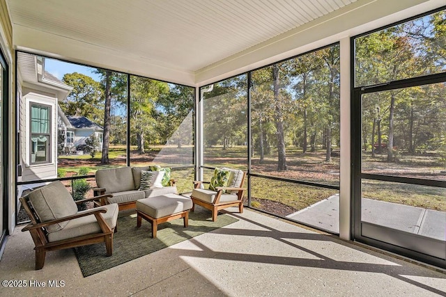 3810 River Park Way NE, Leland, NC 28451 - sunroom / solarium with an outdoor hangout area and view of scattered trees