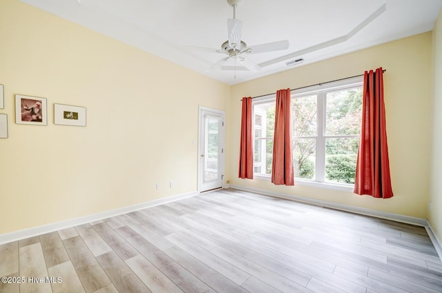 8500 Hammock Dunes Dr, Wilmington, NC 28411 - unfurnished room with light wood-style floors, ceiling fan, and baseboards