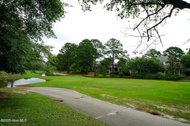 8500 Hammock Dunes Dr, Wilmington, NC 28411 - view of community with a yard and a water view