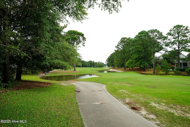 8500 Hammock Dunes Dr, Wilmington, NC 28411 - view of property's community with a water view and a yard