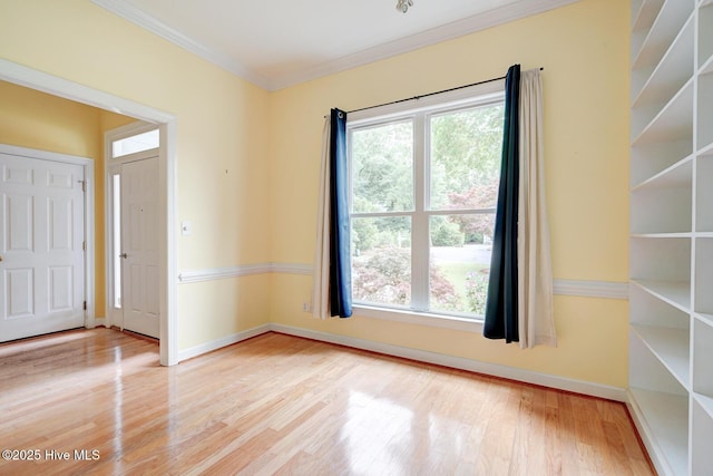 8500 Hammock Dunes Dr, Wilmington, NC 28411 - spare room featuring healthy amount of natural light, wood finished floors, crown molding, and baseboards
