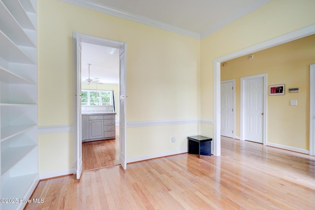 8500 Hammock Dunes Dr, Wilmington, NC 28411 - unfurnished room with light wood-type flooring, ornamental molding, baseboards, and a ceiling fan