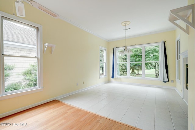 8500 Hammock Dunes Dr, Wilmington, NC 28411 - unfurnished room with ornamental molding, baseboards, wood finished floors, and a chandelier