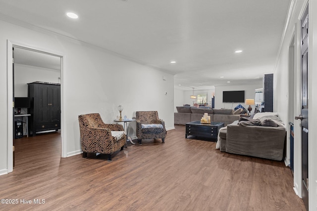 140 One Down St, Southern Pines, NC 28387 - living area with ornamental molding, wood finished floors, recessed lighting, and baseboards