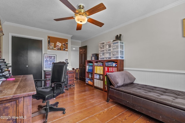 140 One Down St, Southern Pines, NC 28387 - office area with a ceiling fan, hardwood / wood-style flooring, ornamental molding, a wainscoted wall, and a textured ceiling